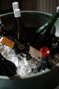 Premium beer and wine package bottles chilled on ice